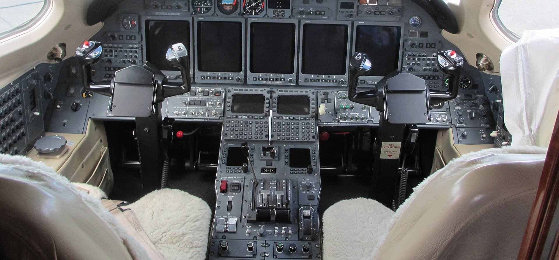 Business jet cockpit instrument panel and control yokes